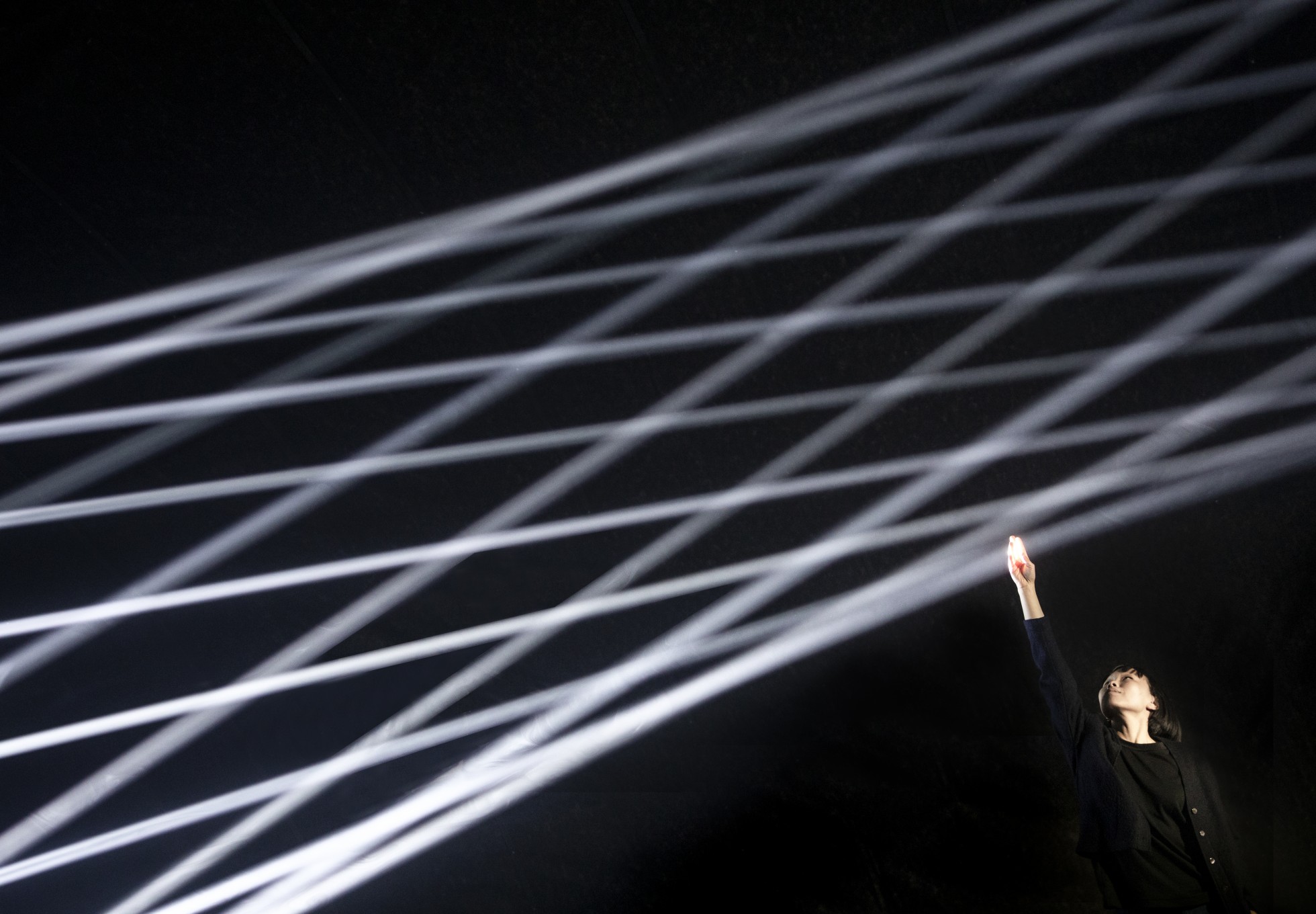 thegreeneyl licht light installation bodies in motion design week milan woman touching light signals